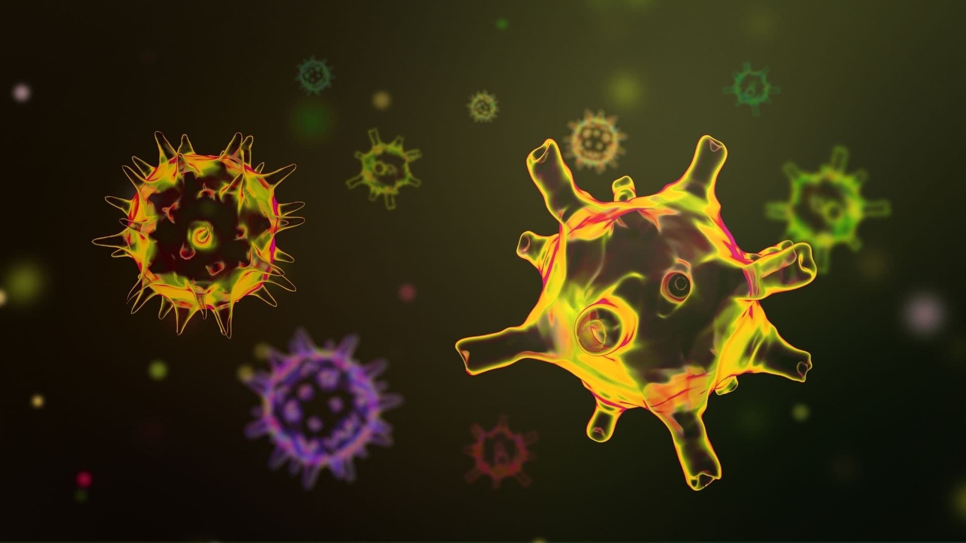 A cluster of virus particles rendered in yellow, green and violet against black